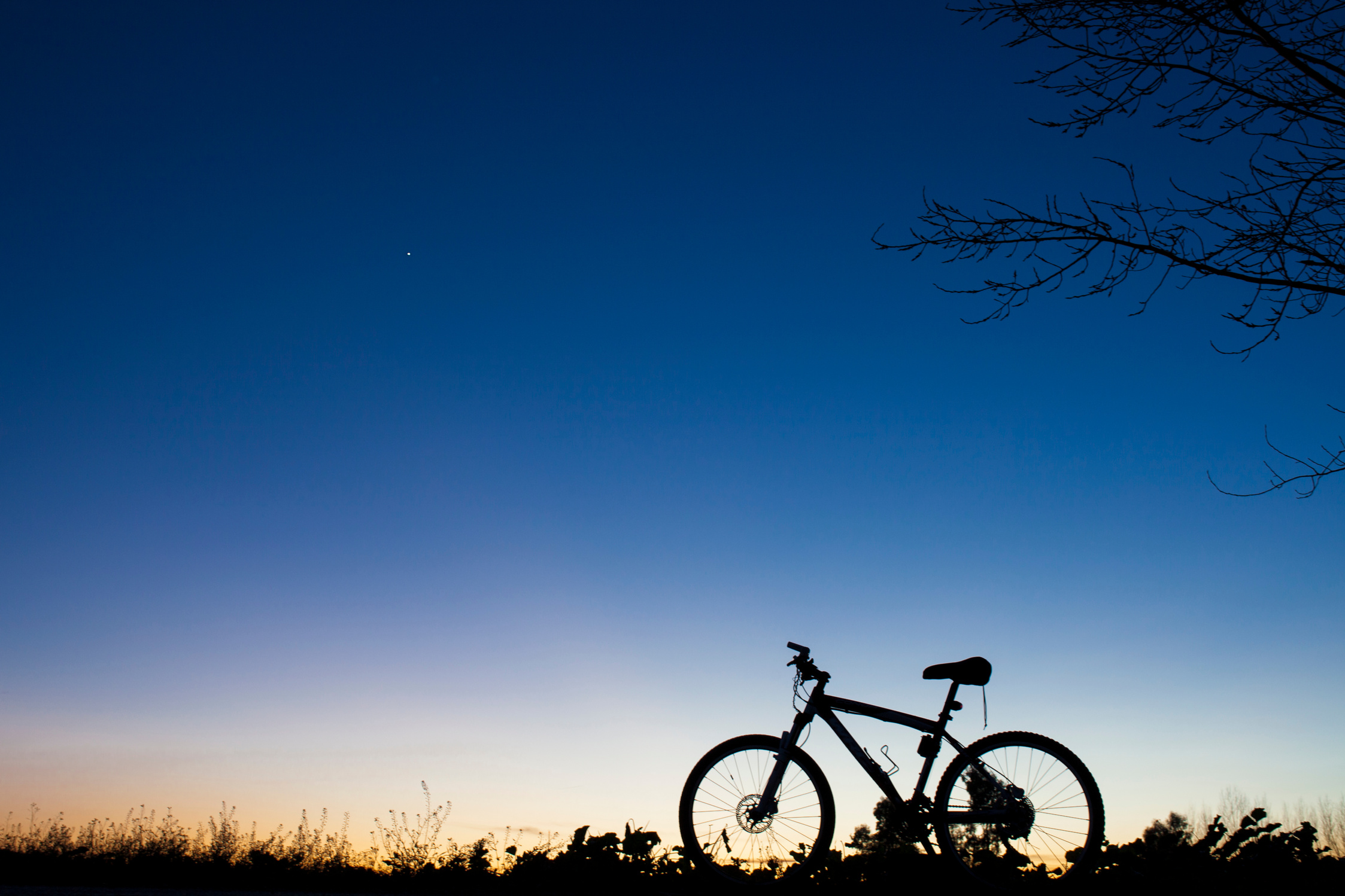 Silhouette of Mountain bike at sunset